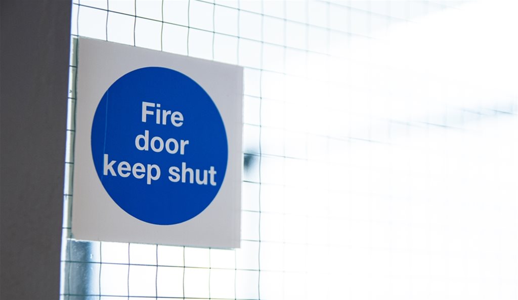 What is the purpose of a fire door?